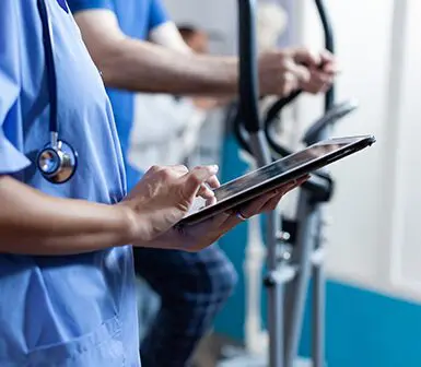 Doctor using a digital tablet in a modern hospital